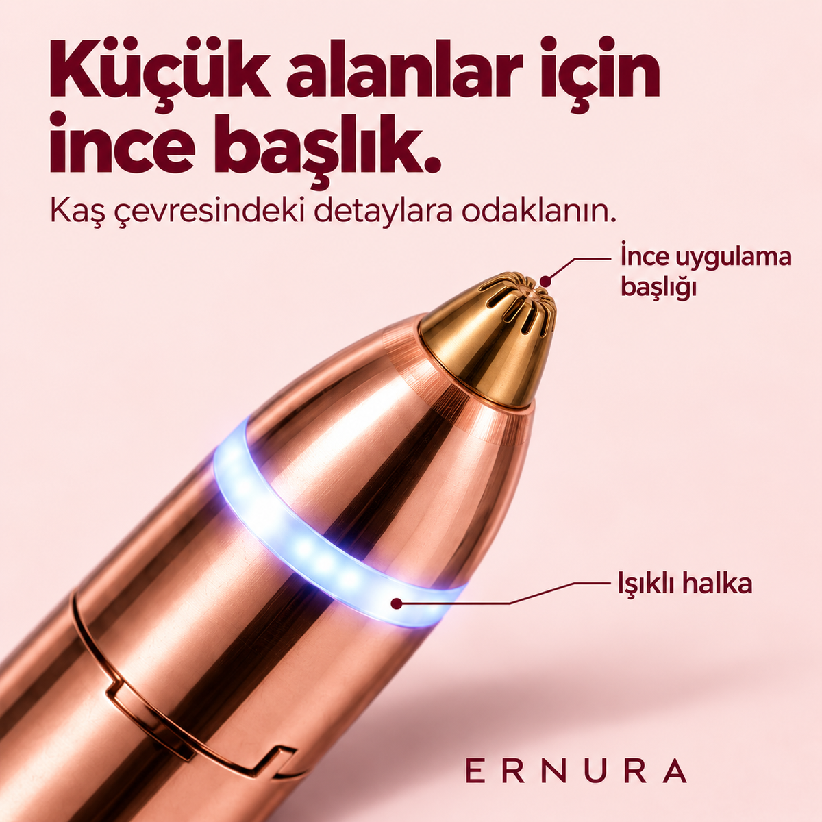 Kalem tipi kaş tüy alma aletinin ince altın renkli başlığı ve ışıklı halkasının yakın planı
